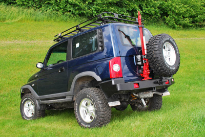 Бампер задний с квадратом под фаркоп и калиткой для Ssang Yong Korando (TAGAZ Tager) РИФ